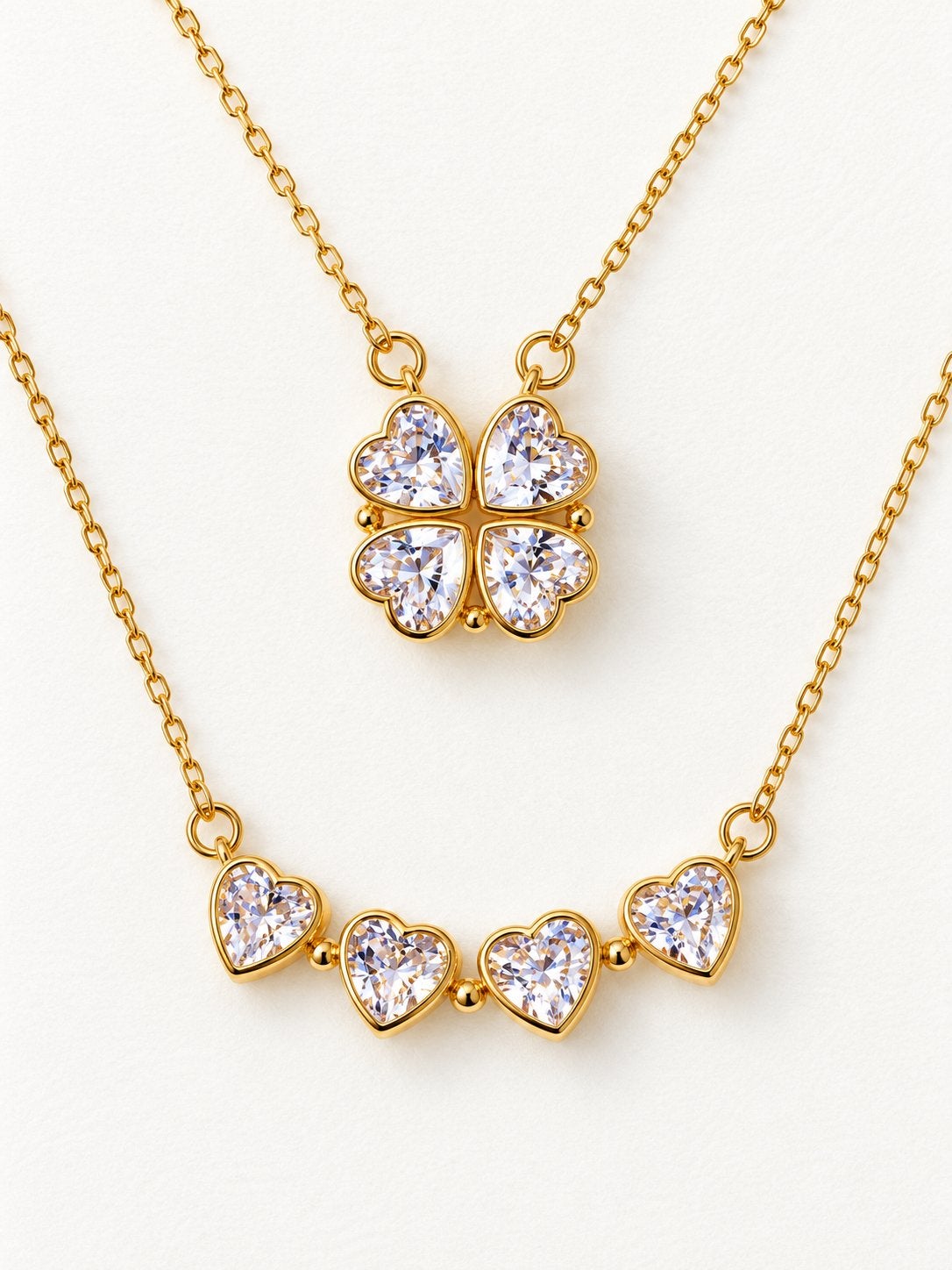 2-in-1 Klavertje Vier Hartjes Ketting - Zilver & Goud, Nieuw, Ophalen of Verzenden, Goud, Overige materialen