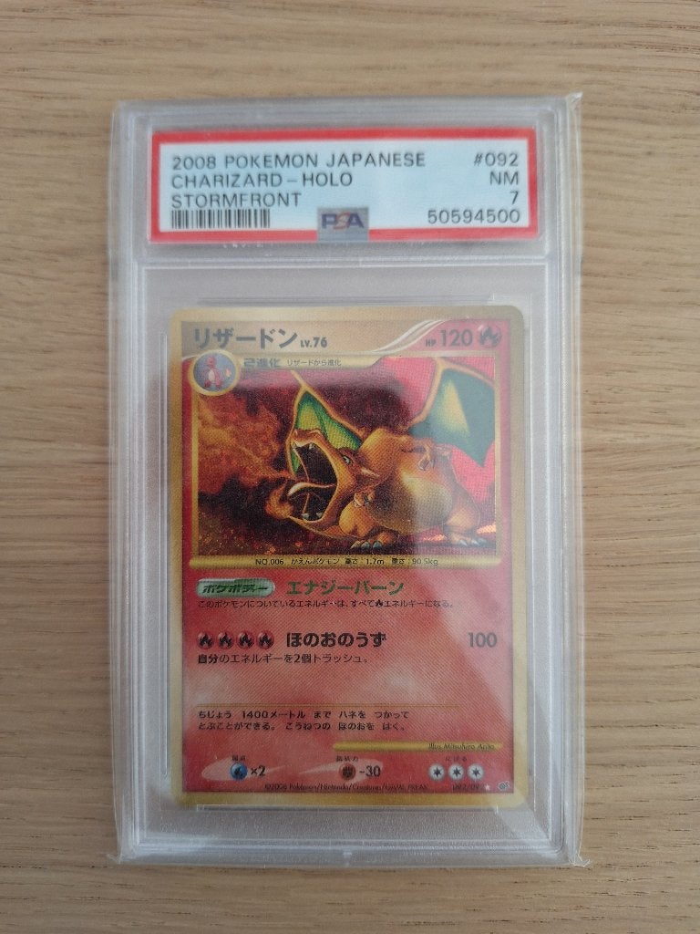 2008 Japanse Charizard Holo Stormfront PSA 7 Pokémon Kaart, Ophalen of Verzenden, Zo goed als nieuw, Losse kaart