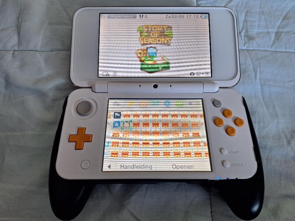 New Nintendo 2DS XL wit/oranje, Ophalen of Verzenden, Zo goed als nieuw, Dsi