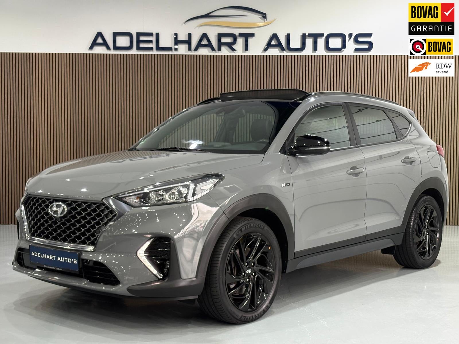 Hyundai Tucson 1.6 T-GDI N-Line Nardo Grey 177 PK automaat P, Auto's, Dealer onderhouden, 15 km/l, Gebruikt, 4 cilinders