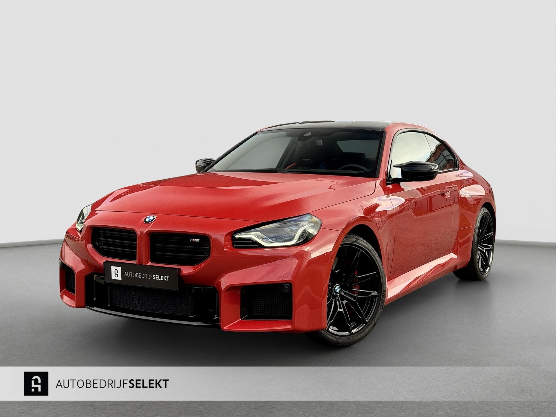 BMW 2-serie Coupé M2 | G87 | Toronto rood metallic | Carbon, Automaat, Achterwielaandrijving, 2 stoelen, Geïmporteerd
