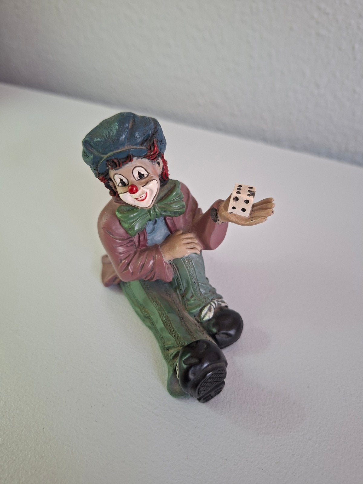 Gilde Clowns beeldje met dobbelstenen, Ophalen