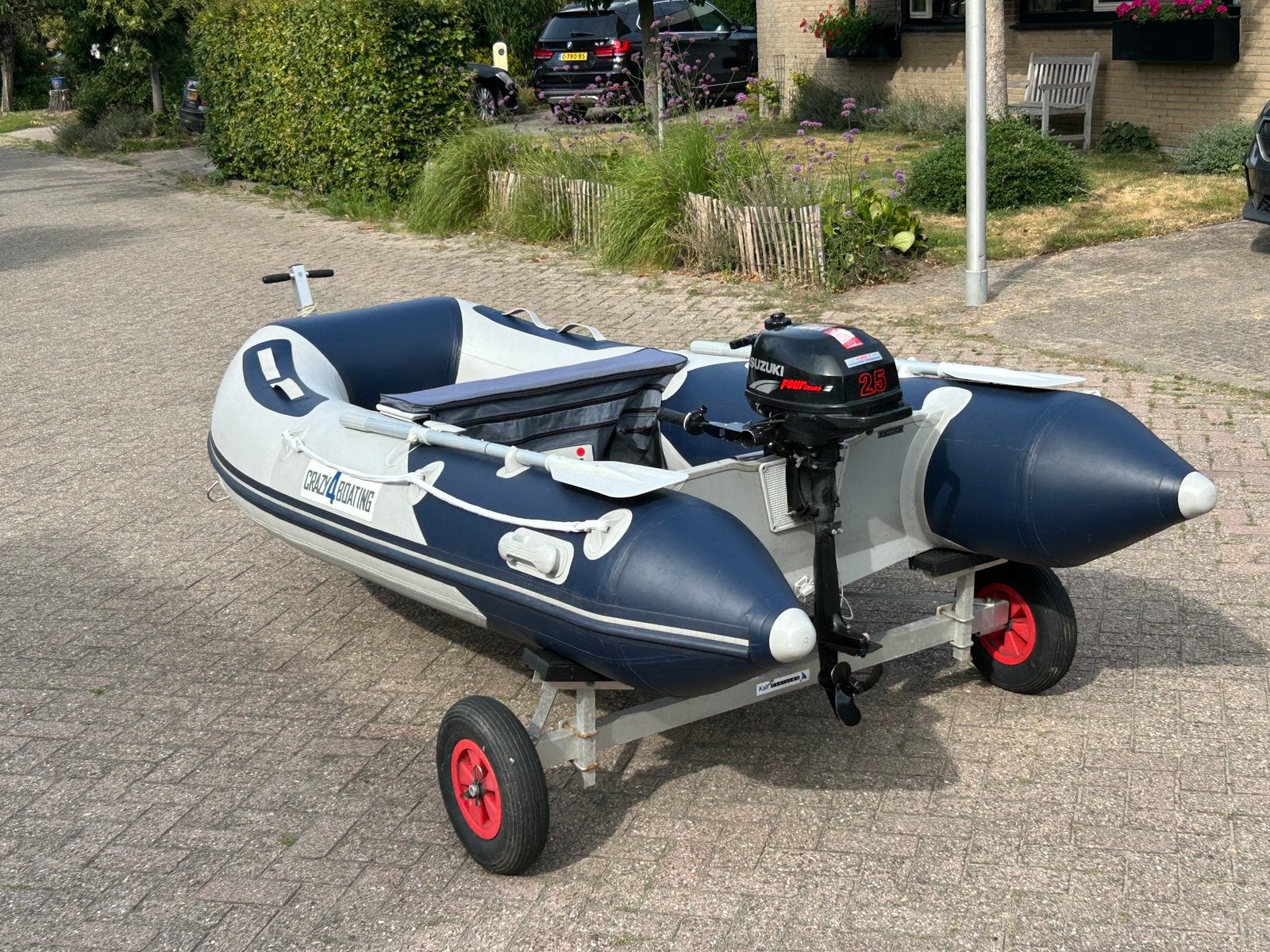 Rubberboot + 2,5pk 4 tact + trailer, Ophalen, Zo goed als nieuw