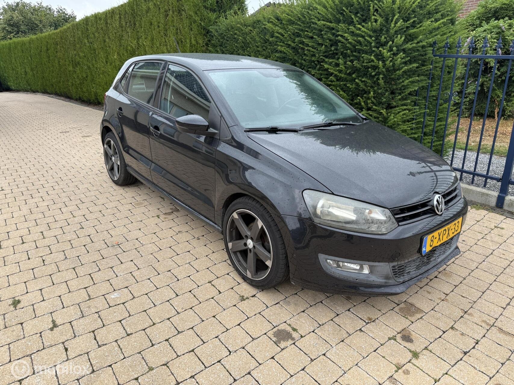 Volkswagen Polo 1.2 Easyline MET COMPLEET GEREVISEERDE MOTOR, Auto's, Voorwielaandrijving, Euro 5, Zwart, 1198 cc