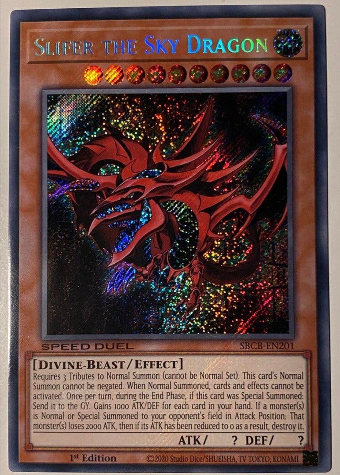 Yu-Gi-Oh! Slifer the Sky Dragon SBCB 1st Edition !, Ophalen of Verzenden, Zo goed als nieuw, Losse kaart, Foil