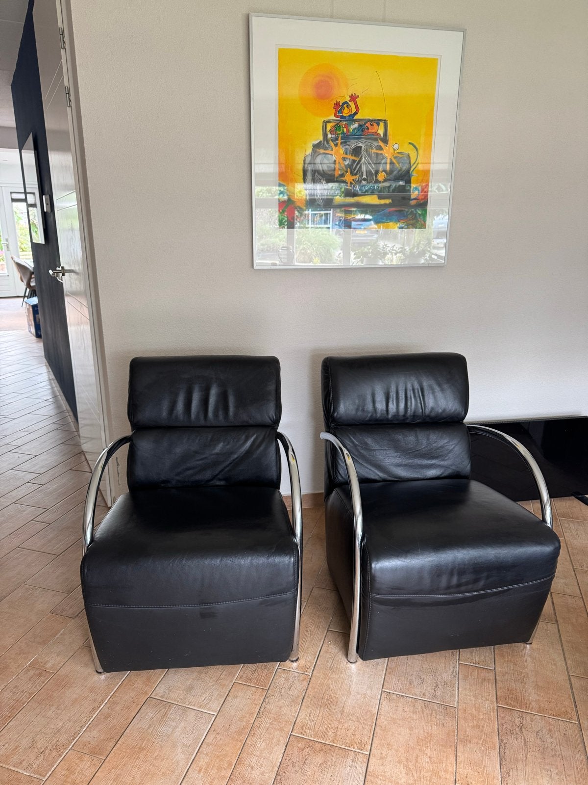 Set van 2 zwarte leren fauteuils met chromen armleuningen, Huis en Inrichting, Ophalen, Gebruikt, Leer, 75 tot 100 cm