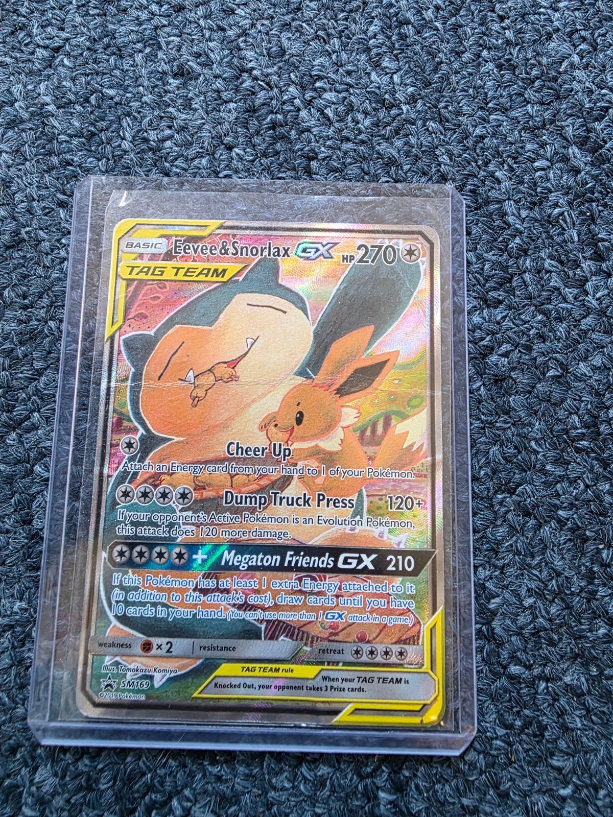 Eevee & Snorlax GX Promo SM169 - Beschadigd, Hobby en Vrije tijd, Verzamelkaartspellen | Pokémon, Ophalen of Verzenden, Gebruikt