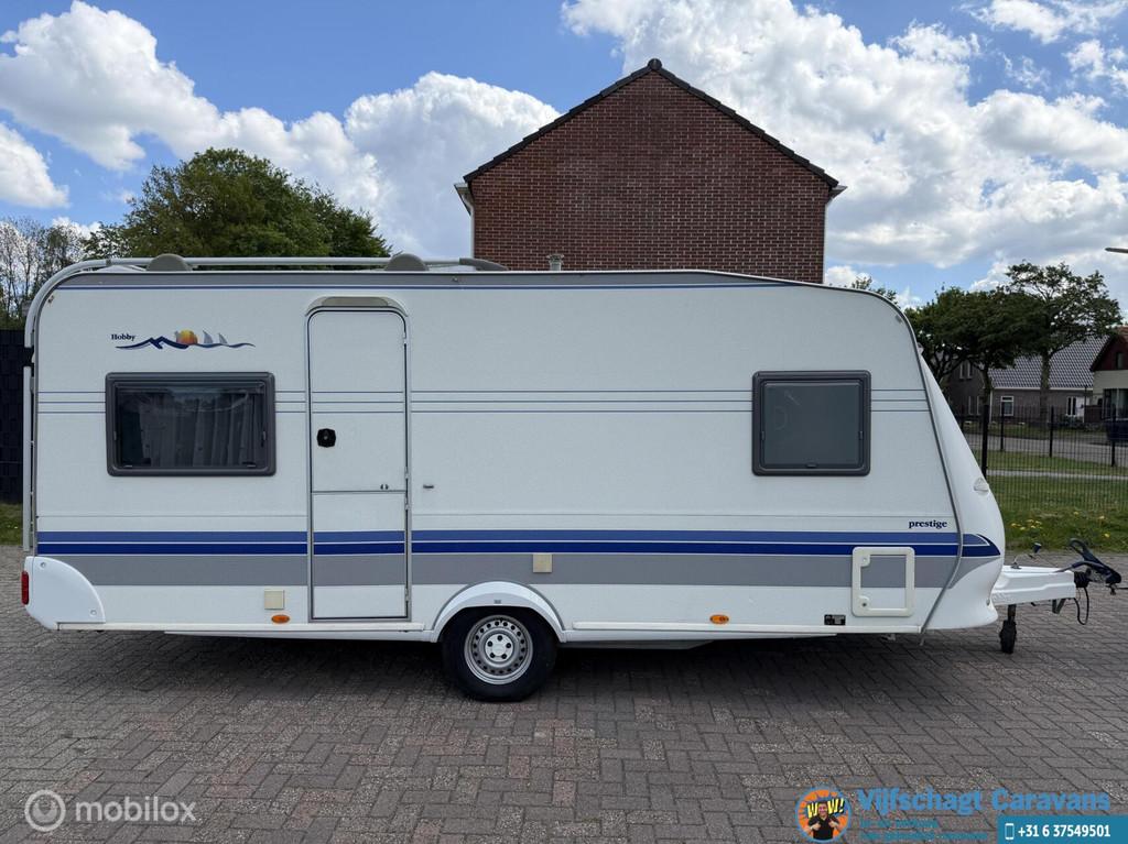 Hobby Prestige 495 UFe incl voortent en airco, Caravans en Kamperen, Caravans, Hobby, Bedrijf, Schokbreker, 6 tot 7 meter