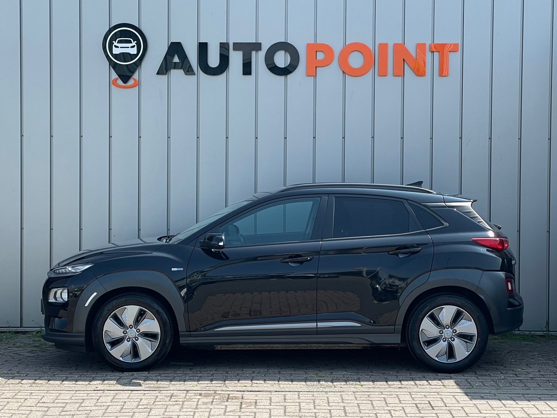 Hyundai Kona EV Fashion 64 kWh FASE3 WARMTEPOMP SOH100%|HEAD, Auto's, Stof, Gebruikt, 80 min, Zwart