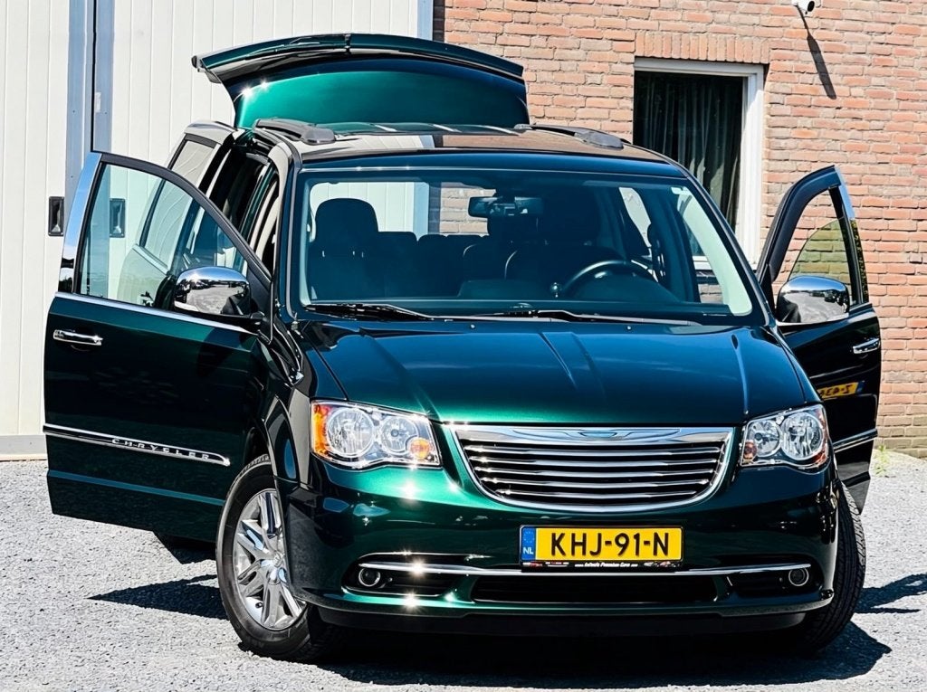 Chrysler Grand Voyager 3.6 V6 LIMITED J.DAIMLER EMERALD-GREE, Auto's, Gebruikt, Zwart, Grand Voyager, Parkeersensor