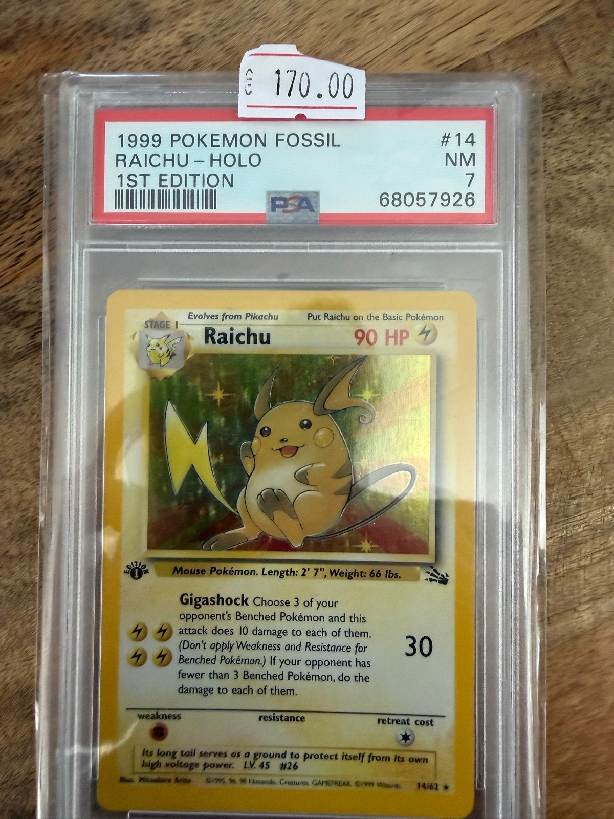 1999 Pokémon Fossil Raichu Holo 1st Edition PSA 7, Ophalen of Verzenden, Zo goed als nieuw, Losse kaart, Foil