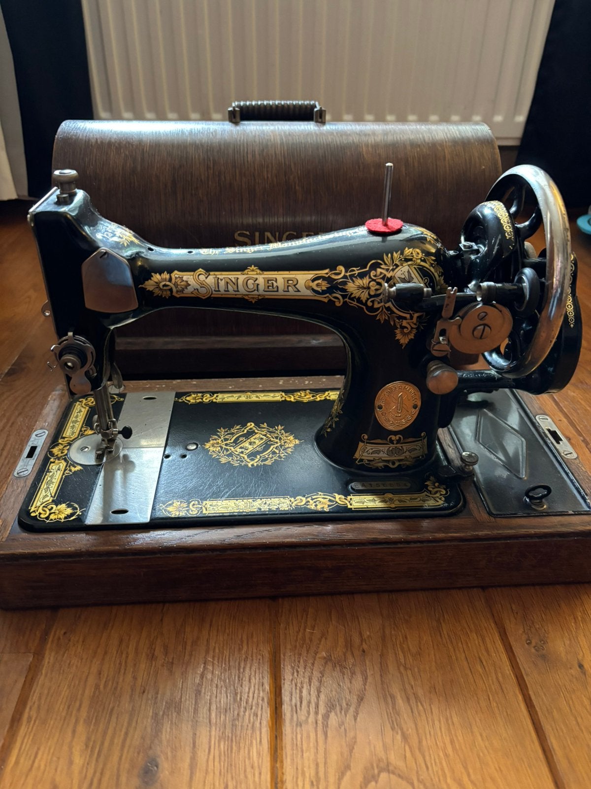 Singer naaimachine met bescherm kap, Ophalen