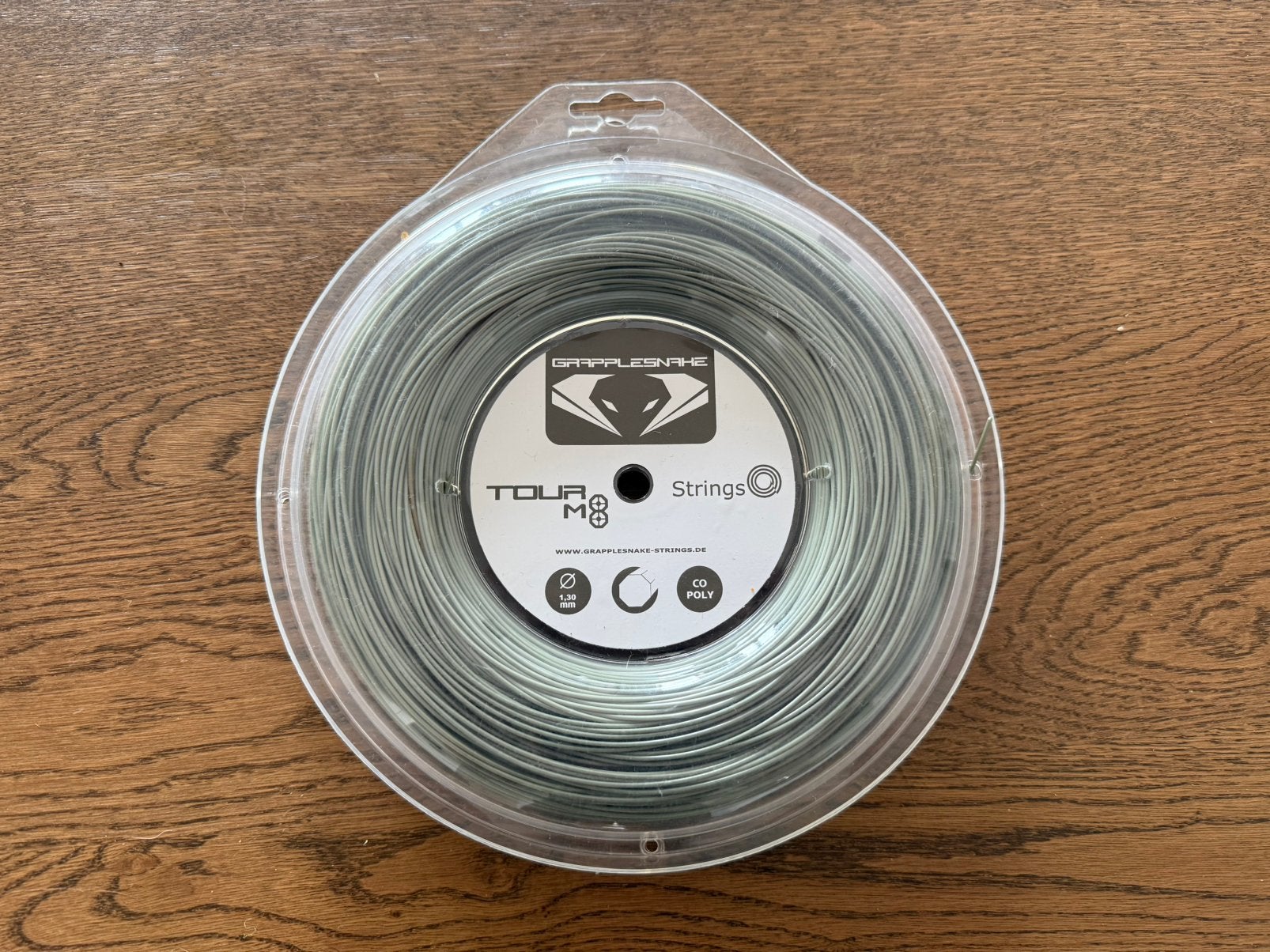 New reel Grapplesnake Tour M8 1.30mm unused, Sport en Fitness, Tennis, Nieuw, Racket, Overige merken, Ophalen of Verzenden