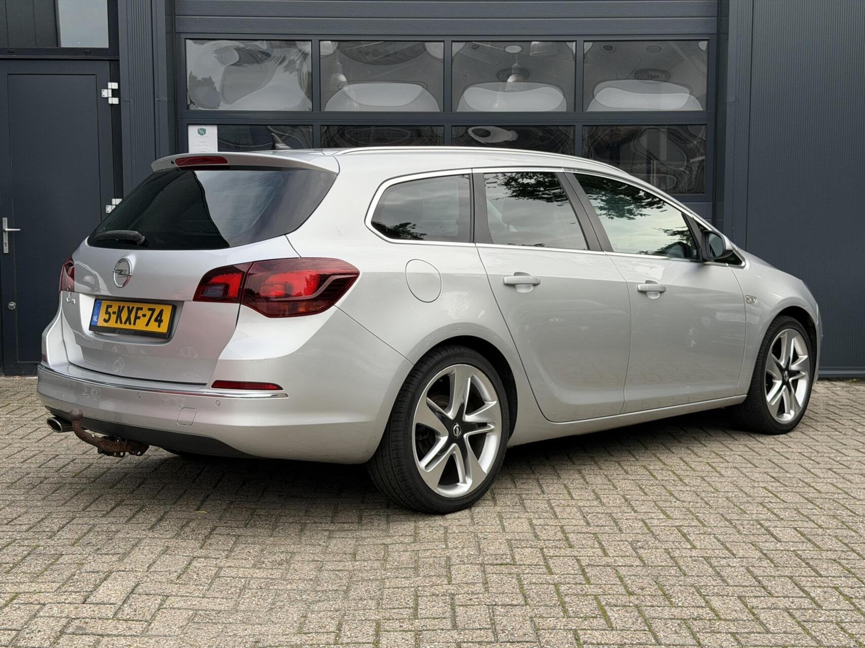 Opel Astra Sports Tourer 1.4 Turbo | Airco | Cruise, Voorwielaandrijving, Euro 5, Gebruikt, 4 cilinders