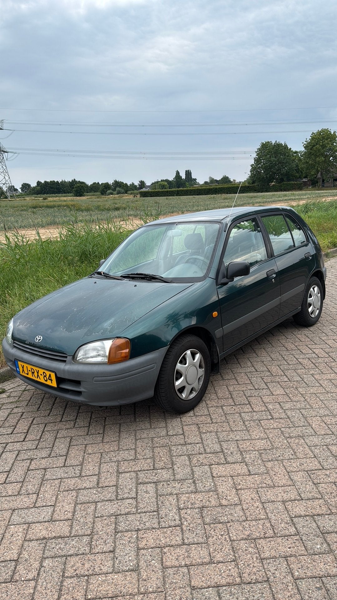 Toyota Starlet 1.3 16V 55KW 1998 Groen, Auto's, 15 km/l, 74 pk, 31 €/maand, 4 cilinders