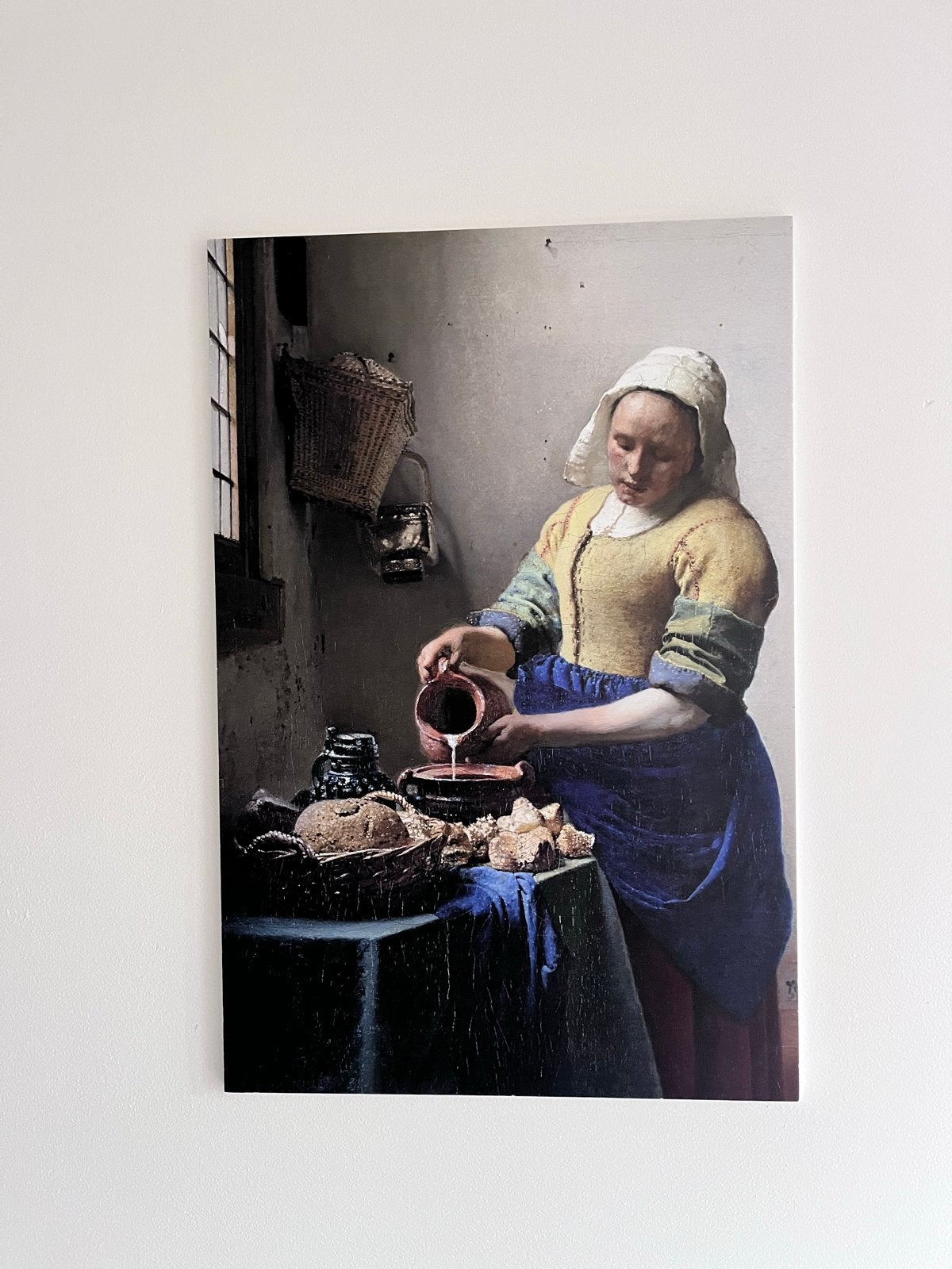 Schilderij Het Melkmeisje van Johannes Vermeer, Ophalen