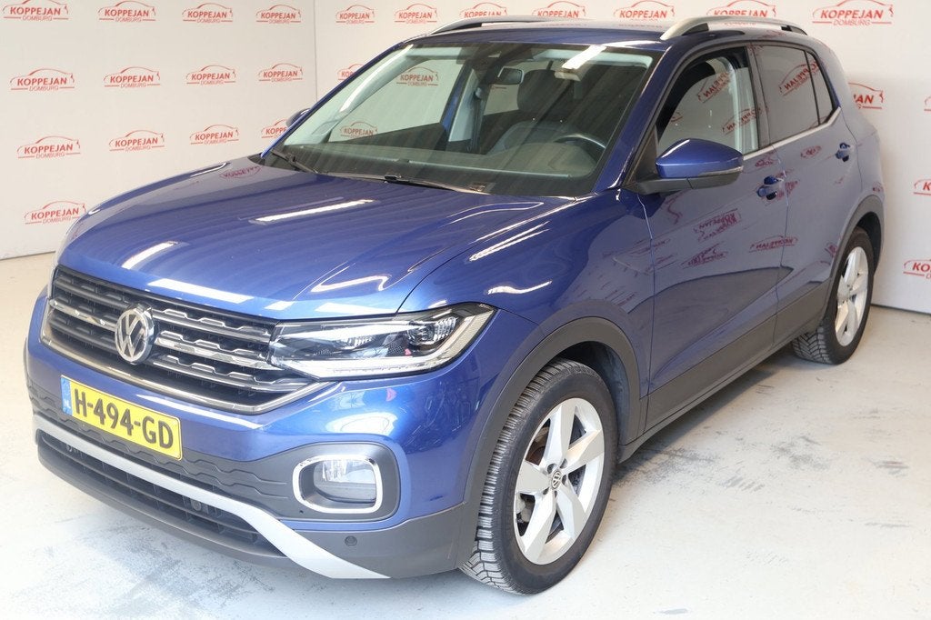 Volkswagen T-Cross 1.0 TSI Style NL auto, ACC, Trekhaak, App, Auto's, Volkswagen, Gebruikt, Blauw, 116 pk, 1175 kg