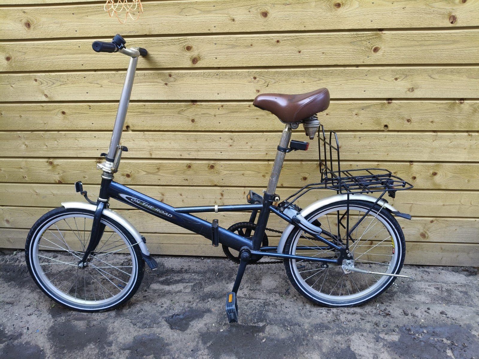Opvouwbare en lichtgewicht fiets met terugtraprem, Ophalen