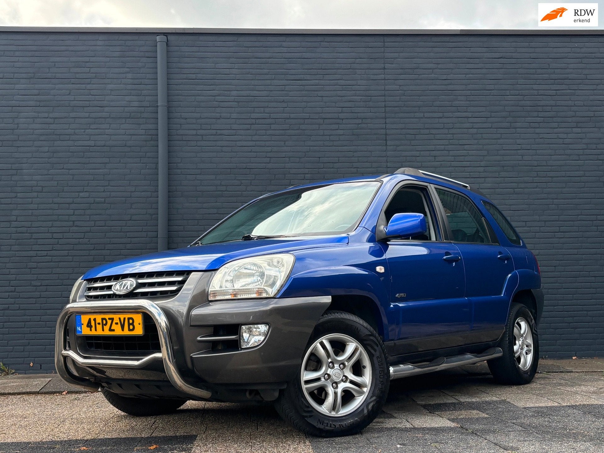 Kia Sportage 2.7 V6 Adventure 4WD | Automaat | Leder | Trekh, Auto's, Gebruikt, Blauw, 2656 cc, Bedrijf