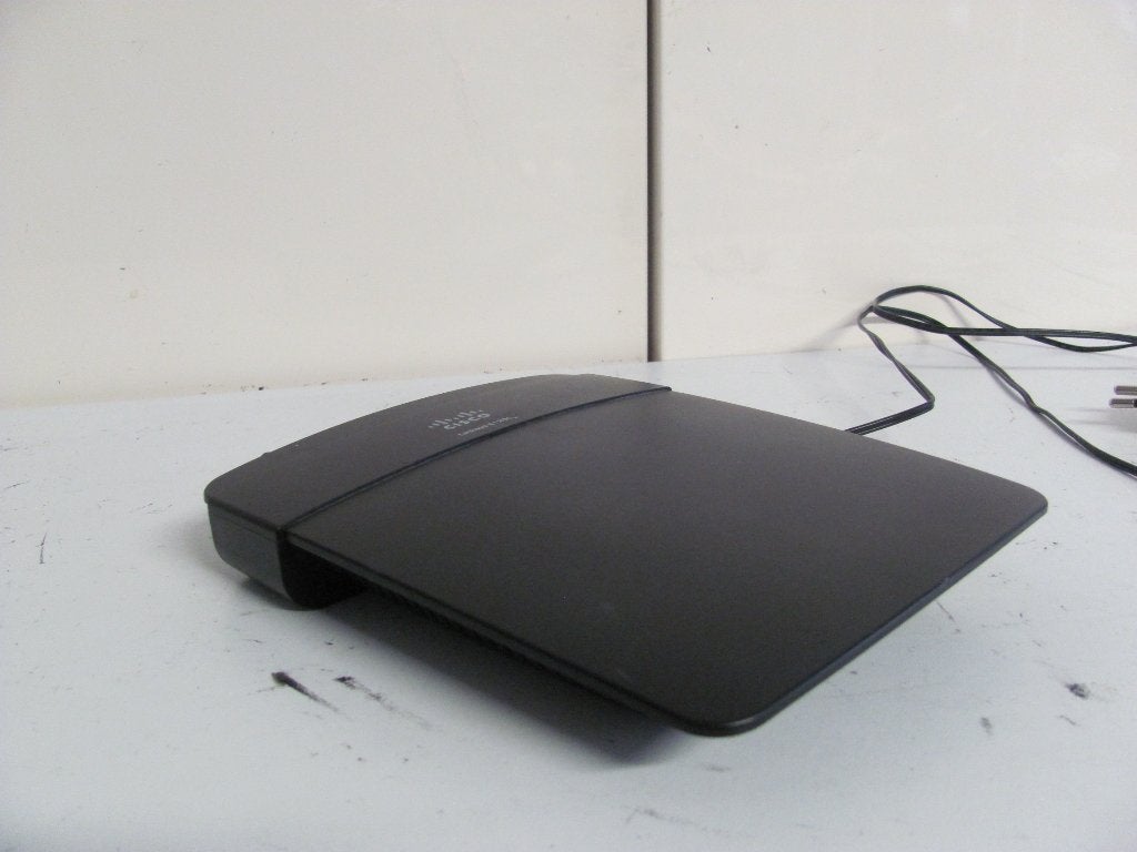 Linksys E1200 cisco router/modem met voedingsadapter, Computers en Software, Routers en Modems, Ophalen of Verzenden, Zo goed als nieuw