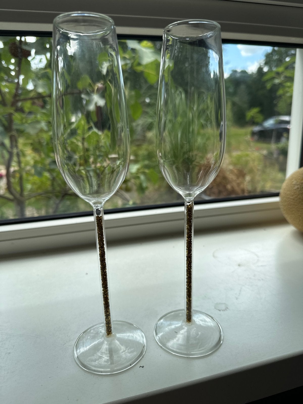 Set van 2 champagneglazen met gouden glittersteel, Overige typen, Ophalen of Verzenden, Zo goed als nieuw, Glas