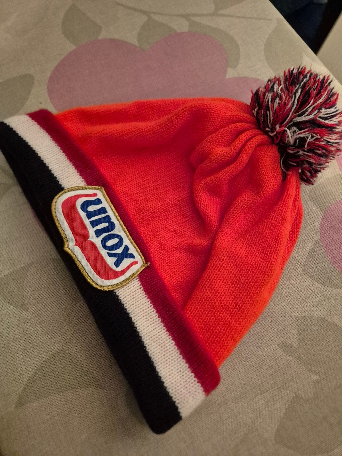 Unox Muts met Pompon - Oranje, Zwart, Wit, Unox, Ophalen of Verzenden, Muts, Maat 56/58 (XL)