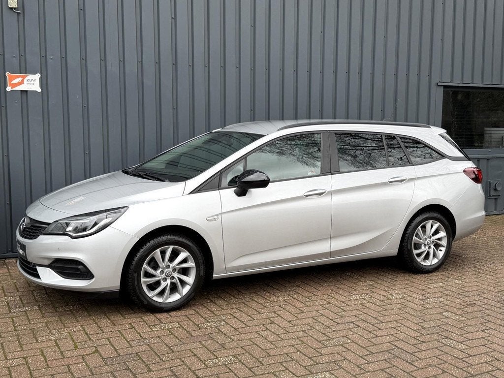 Opel Astra Sports Tourer 1.2 Ultimate 1E EIG.!/DEALER OND.!/, Auto's, Voorwielaandrijving, 145 pk, Stof, Zwart