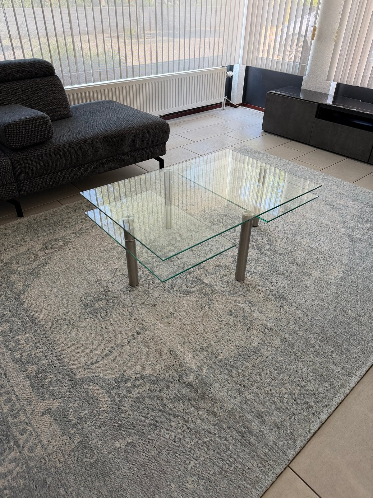 Glazen salontafel met draaibare RVS poten, Ophalen, Gebruikt, 100 tot 150 cm, 50 tot 100 cm