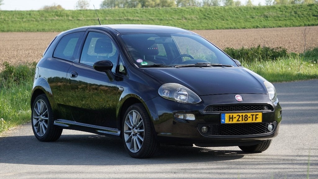 Fiat Punto 1.4 Sport | Airco | Cruise Control | Trekhaak, Voorwielaandrijving, Stof, 40 €/maand, Zwart