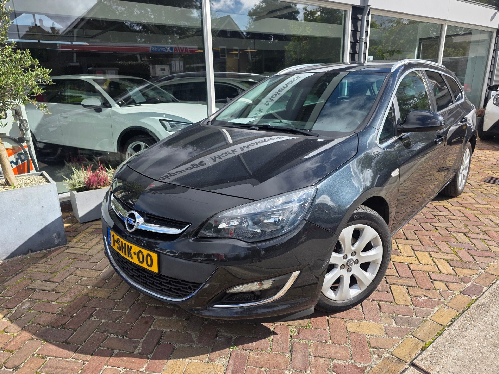 Opel Astra Sports Tourer 1.4 Turbo Cosmo,trekhaak, Auto's, Voorwielaandrijving, Euro 5, Gebruikt, 4 cilinders