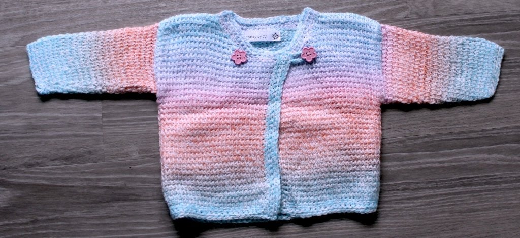 Nieuw babyvestje in zachte kleurtjes Maat 62/68, Kinderen en Baby's, Ophalen of Verzenden, Nieuw, Meisje, Truitje of Vestje