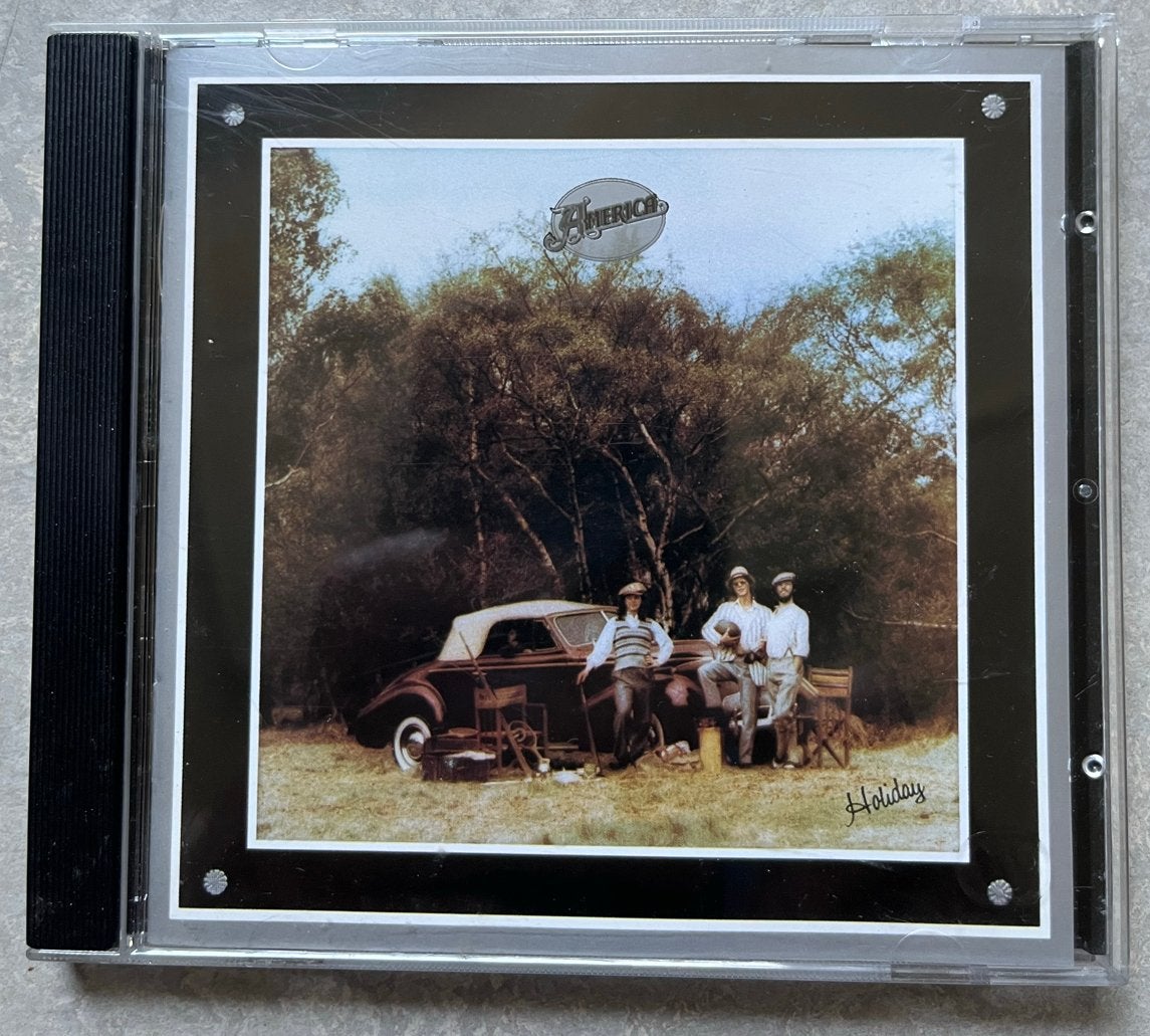America - Holiday CD (1974) - Pop/Rock, Inclusief boekje, Pop, Ophalen of Verzenden, Zo goed als nieuw
