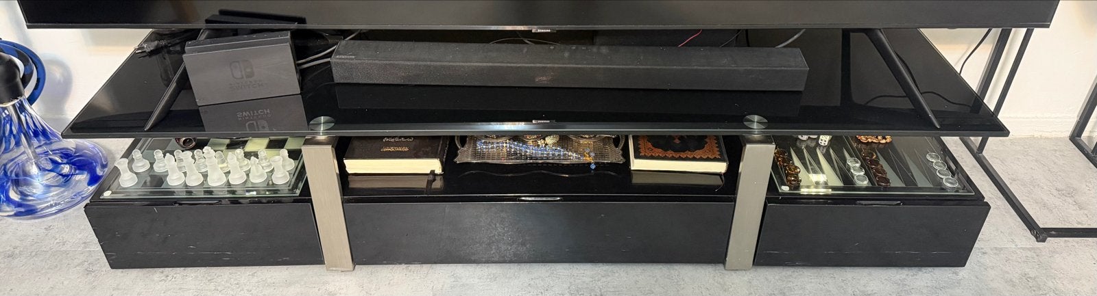 Zwart glazen tv-meubel met opbergruimte, Ophalen, Gebruikt, 100 tot 150 cm, 150 tot 200 cm