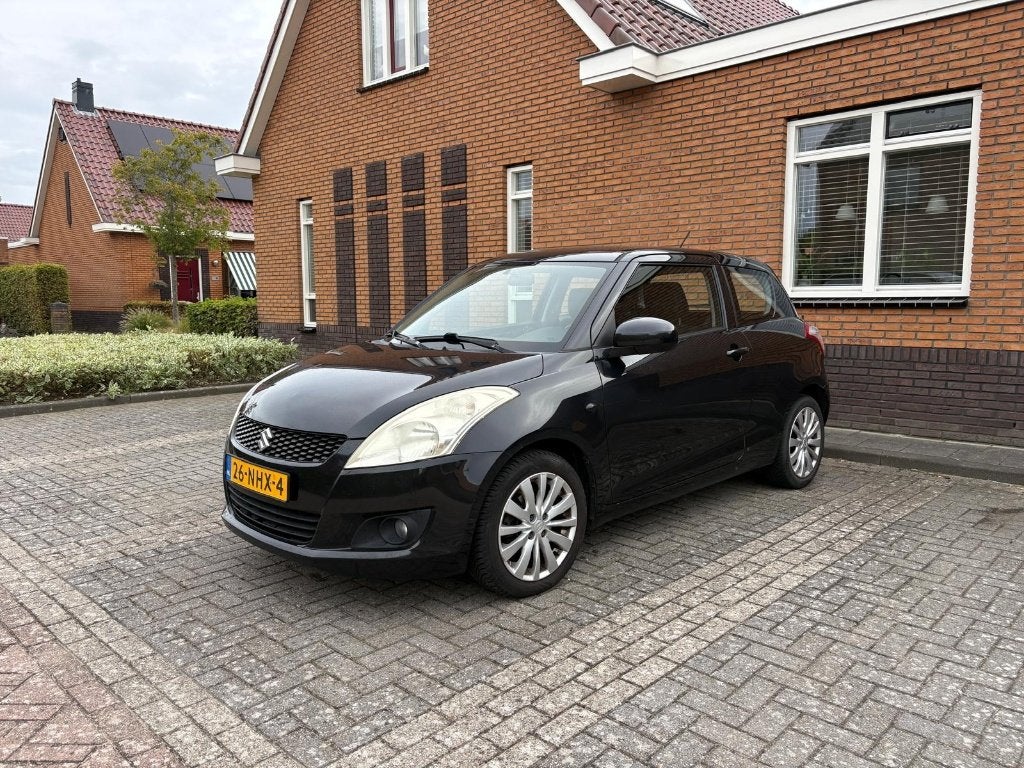 Suzuki Swift 1.2 Exclusive 3-D 2010 Zwart, Voorwielaandrijving, Stof, Origineel Nederlands, Handgeschakeld