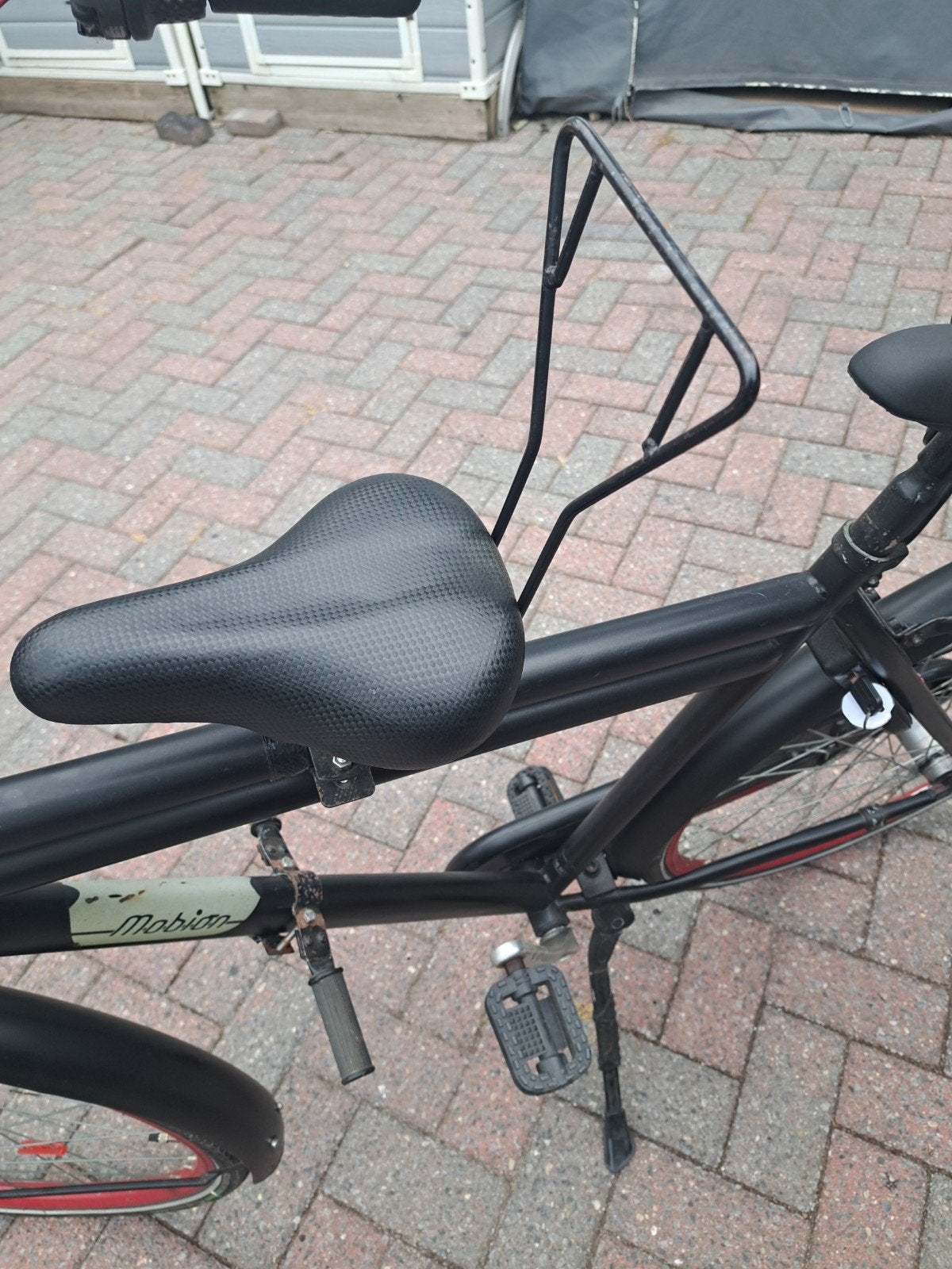 Kinder zadeltje voor op de fiets, Ophalen