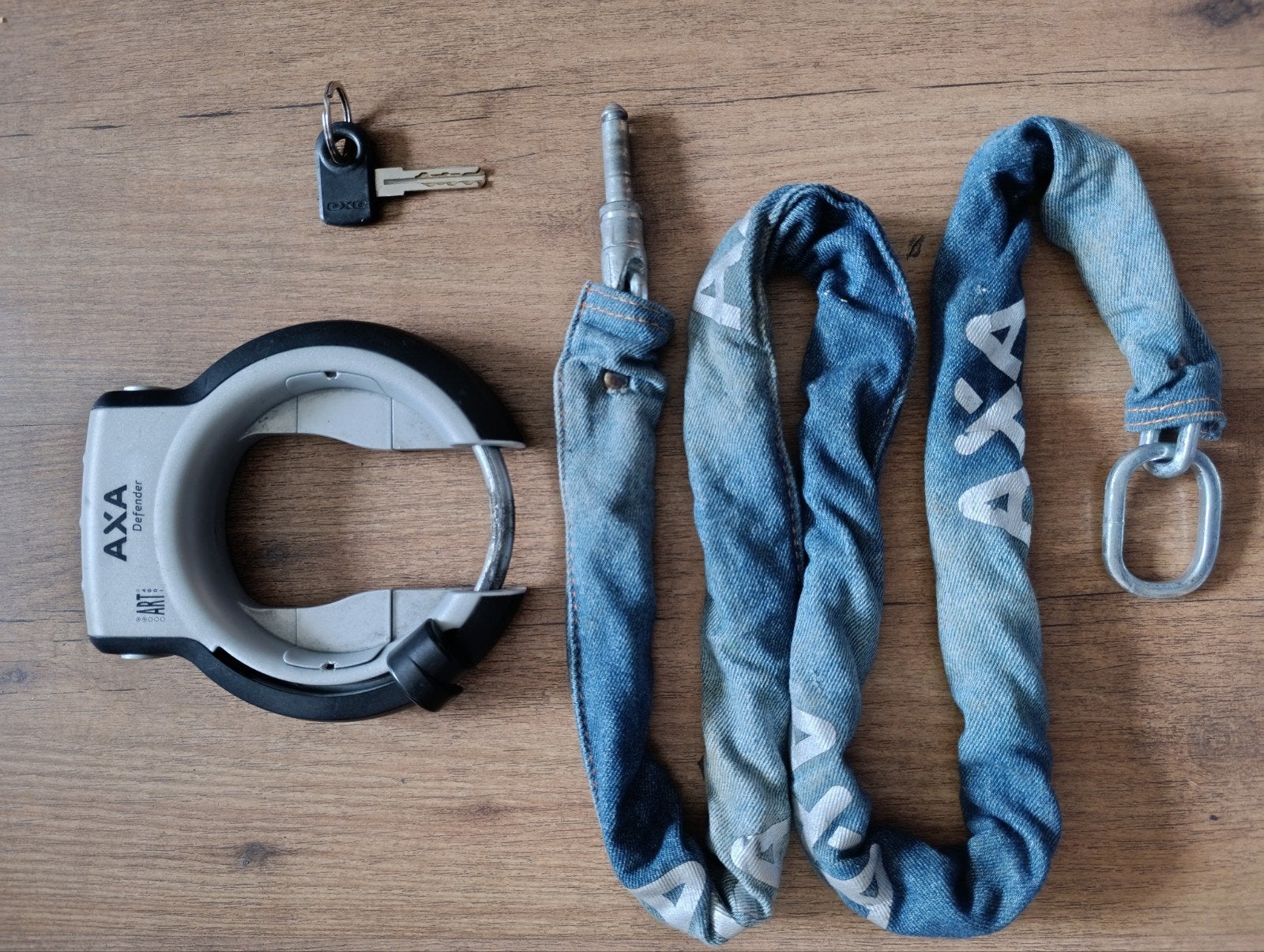 Axa defender met plug in ketting jeans model ., Ophalen of Verzenden, Ringslot