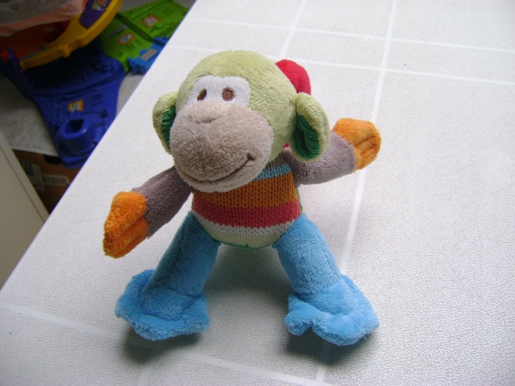 pluche aap met rammeltje en handvat van 13cm groot, Ophalen of Verzenden, Zo goed als nieuw, Meerkleurig, Wasbaar