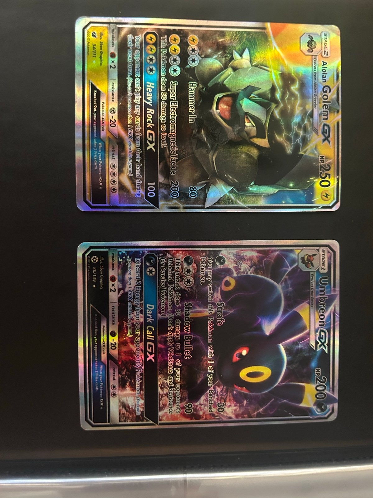 Alolan Golem GX & Umbreon GX Pokémon kaarten, Ophalen of Verzenden, Zo goed als nieuw, Meerdere kaarten, Foil