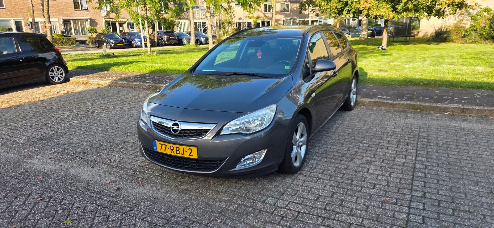 Opel Astra 1.4 Turbo 88KW ST 2011 Grijs, Auto's, Voorwielaandrijving, Stof, Zwart, 4 cilinders