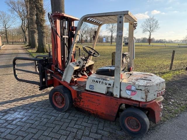 Datsun  2 T heftruck met aangebouwde balenklem, Ophalen, Grondbewerking