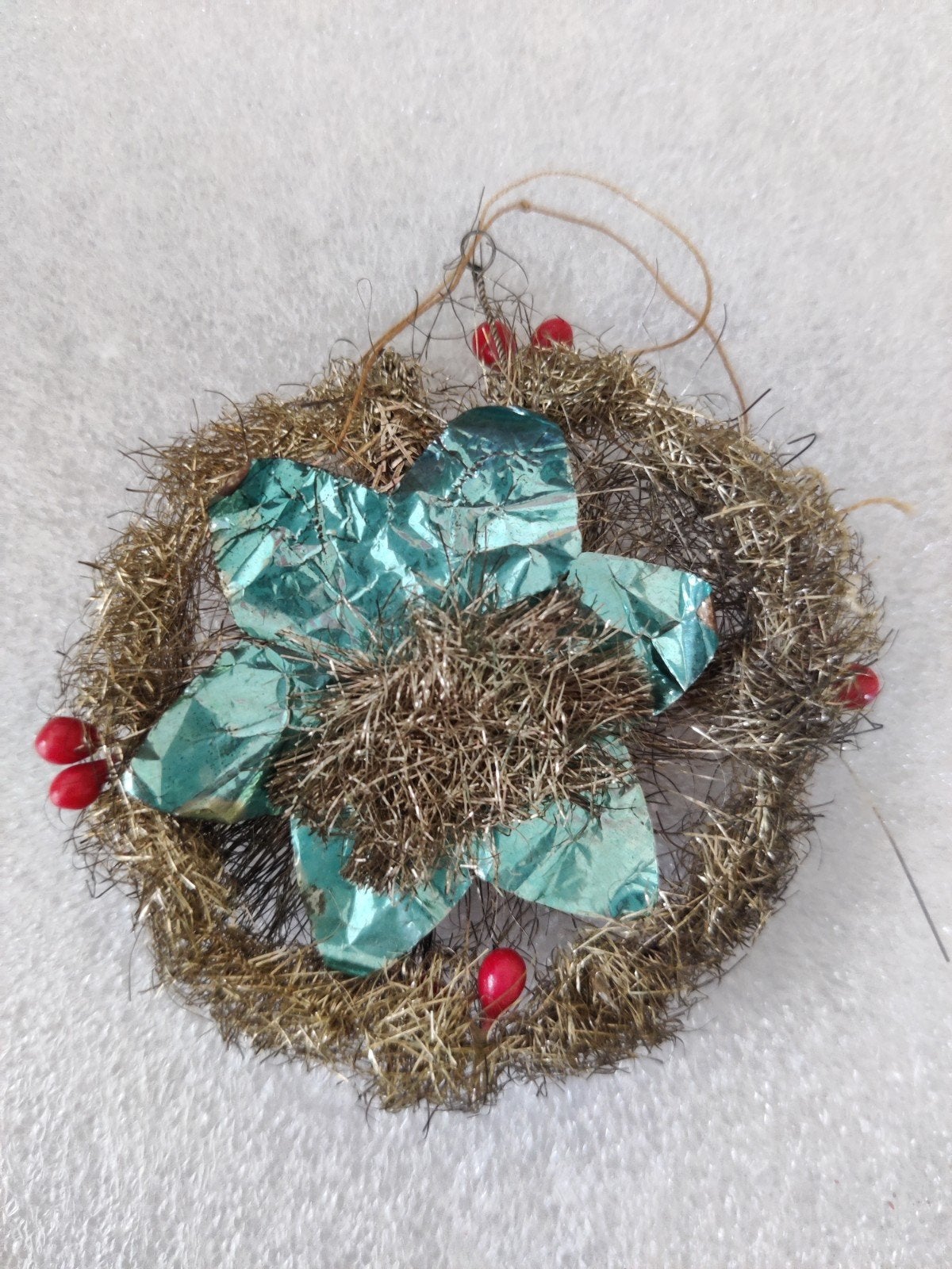 Antiek tinsel kerstornament, Ophalen