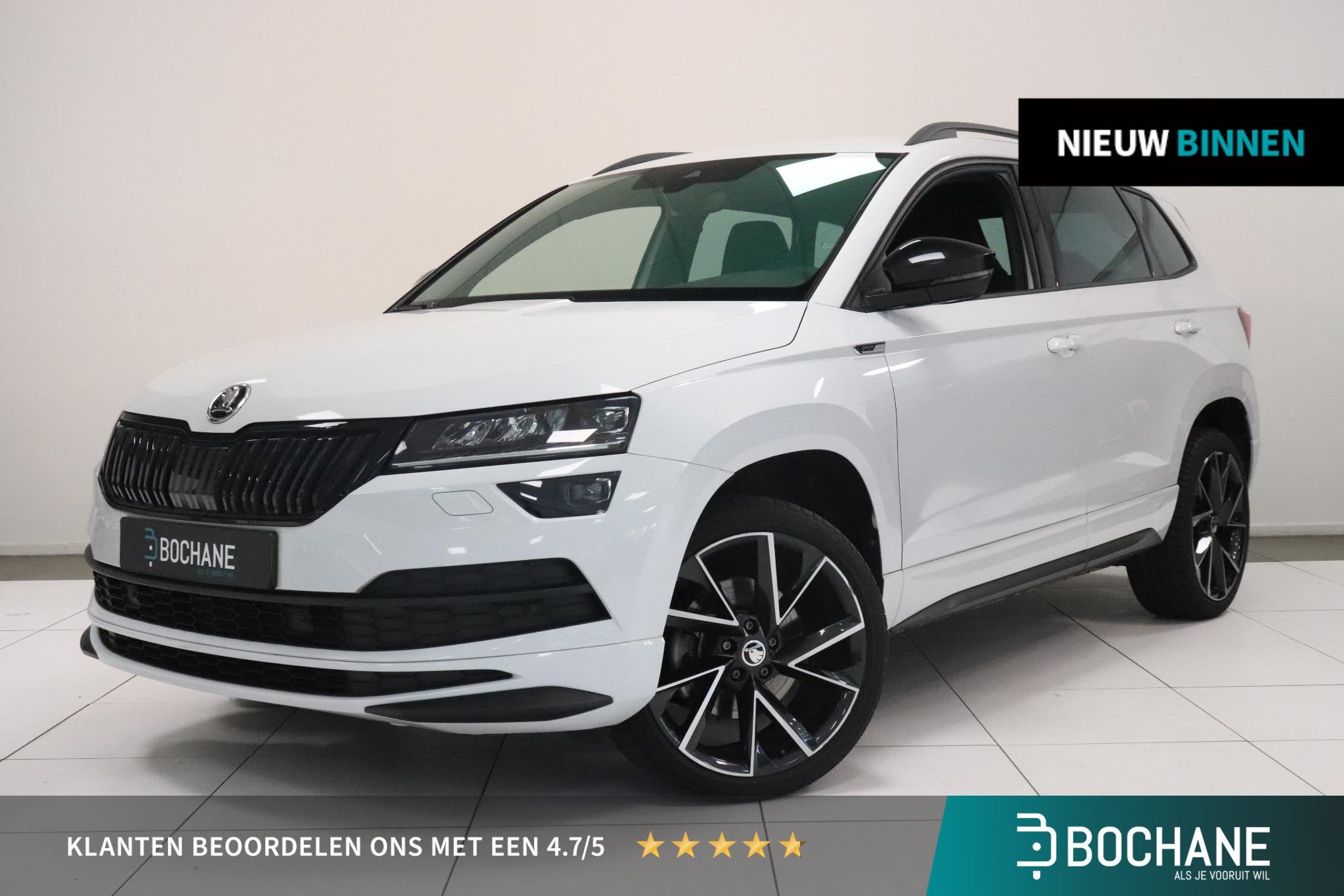 Skoda Karoq 1.5 TSI ACT Sportline Business | Canton audio |, Auto's, Stof, 4 cilinders, Wit, Bedrijf