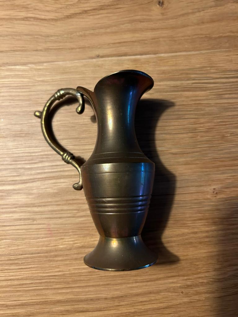 Bronzen kan met handvat, Ophalen