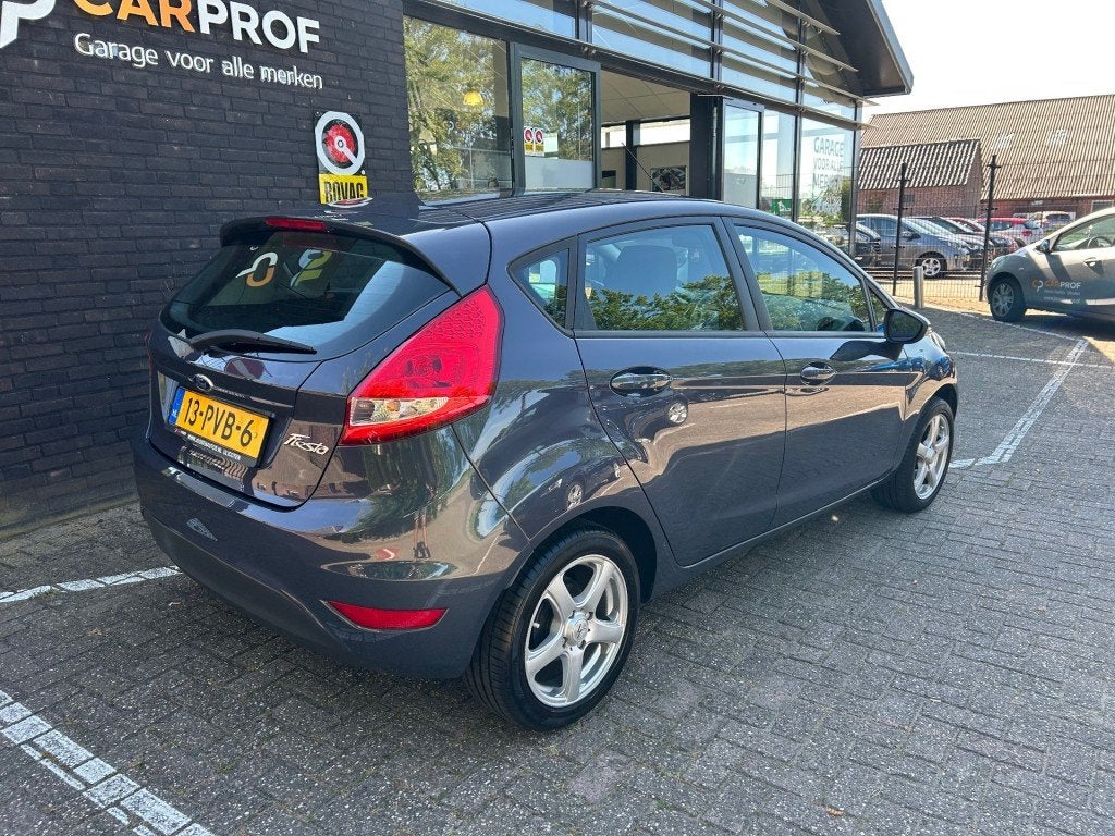 Ford FIESTA 1.25 GHIA, Auto's, Voorwielaandrijving, Euro 5, 4 cilinders, Met garantie (alle)