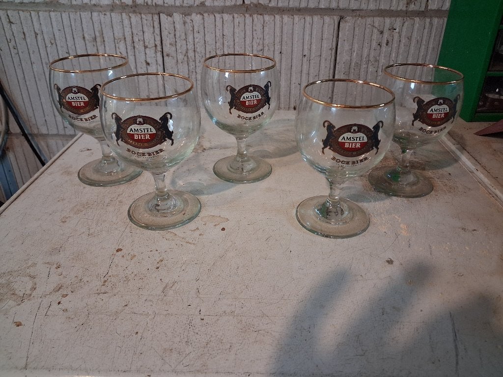 Set van 5 Amstel Bier Bockbier glazen, Ophalen of Verzenden, Zo goed als nieuw, Bierglas