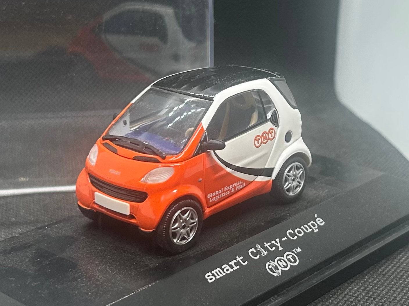 Herpa Smart City Coupé TNT 1:43 OVP, Verzenden, Zo goed als nieuw, Auto, Overige merken
