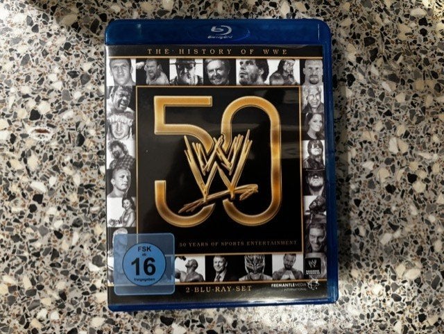 The History of WWE 50 Years of Sports Entertainment, Engels, Overige genres, Ophalen of Verzenden, Zo goed als nieuw