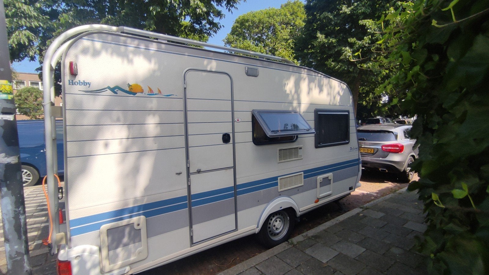 Hobby De Luxe 400 SF 1999 - Compacte en complete caravan, Caravans en Kamperen, Caravans, Vast bed, Kachel, Hobby, Treinzit