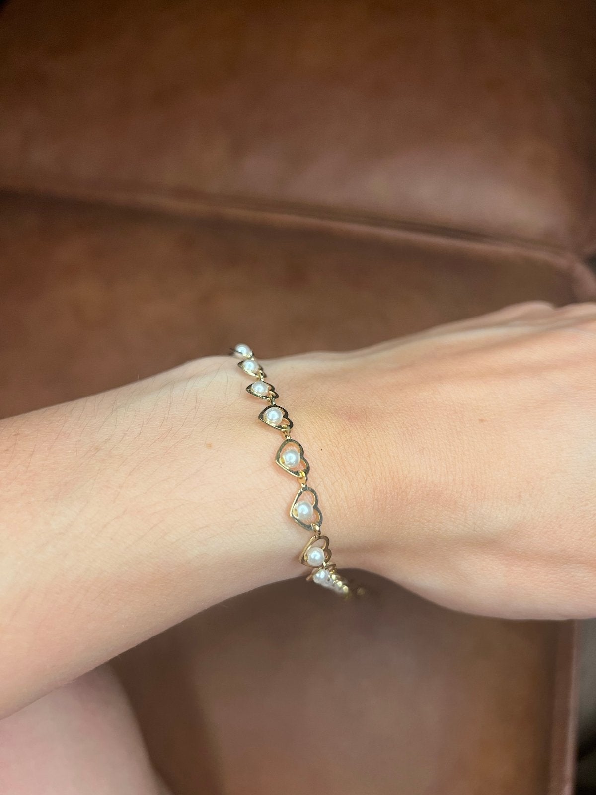 Gouden armband met hartjes en parels, Overige materialen, Ophalen of Verzenden, Zo goed als nieuw, Met bedels of kralen