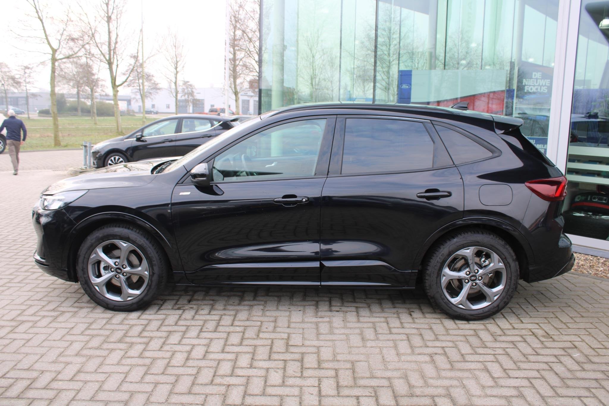 Ford Kuga 2.5 FHEV ST-Line 190pk | Winterpack | Achteruitrij, Stof, Gebruikt, 1589 kg, Zwart